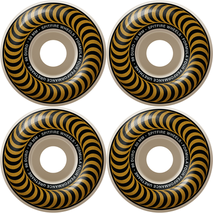 A set of four SPITFIRE formula four skateboard wheels with a gold color and black and yellow swirl pattern.